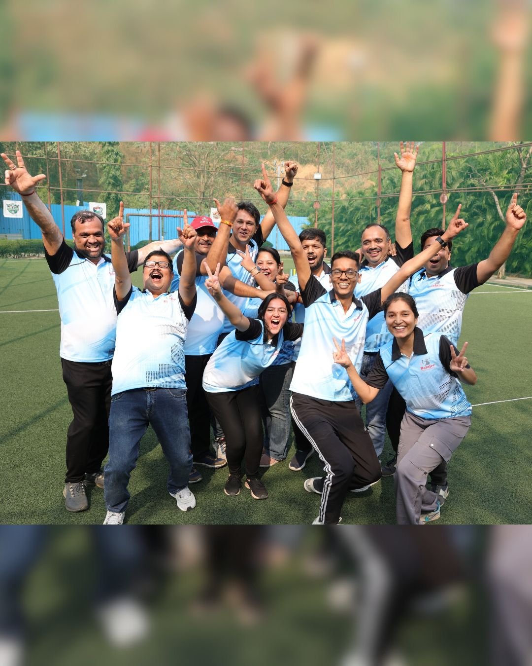 Team members celebrating together outdoors