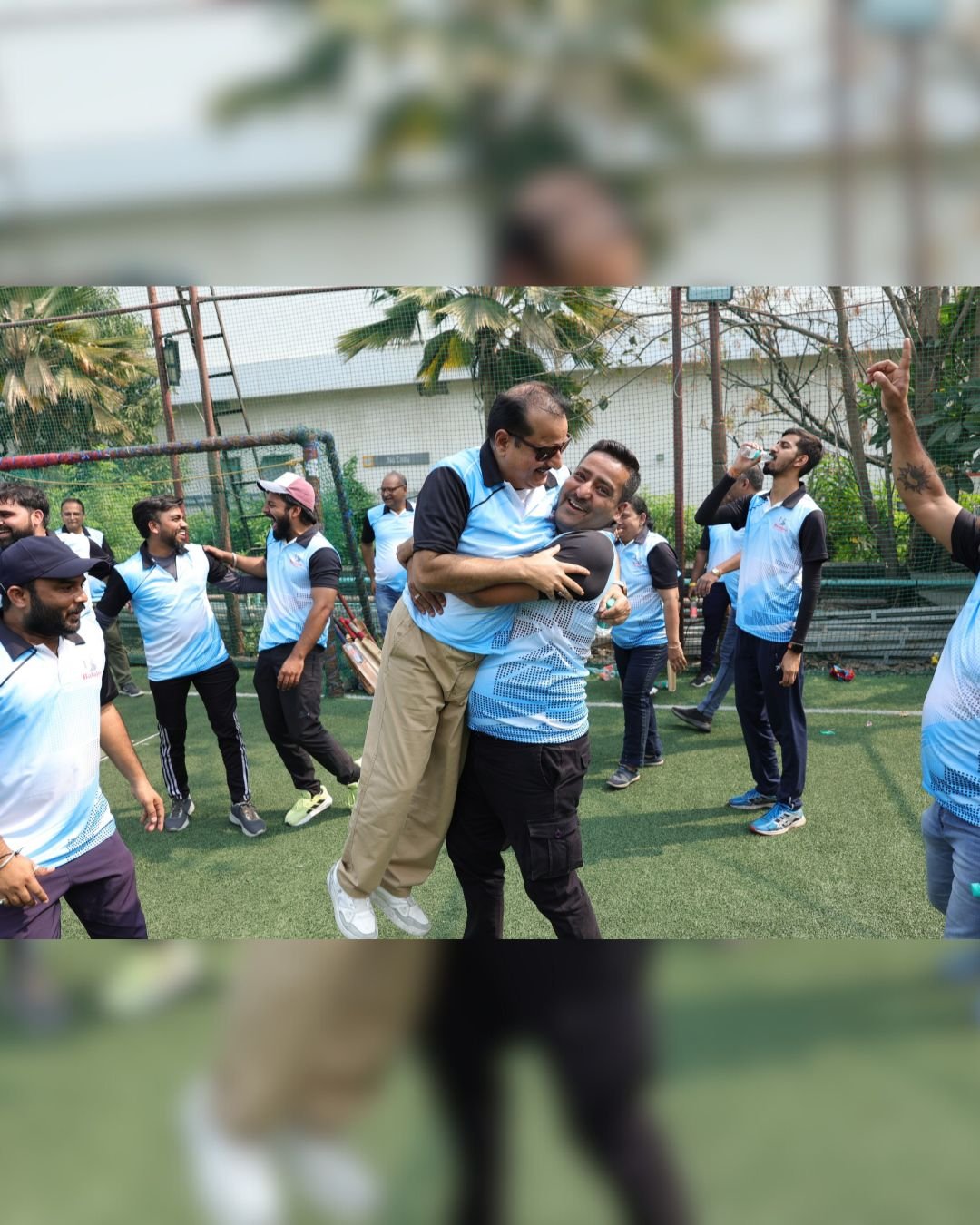 Colleagues greeting one another during a team event