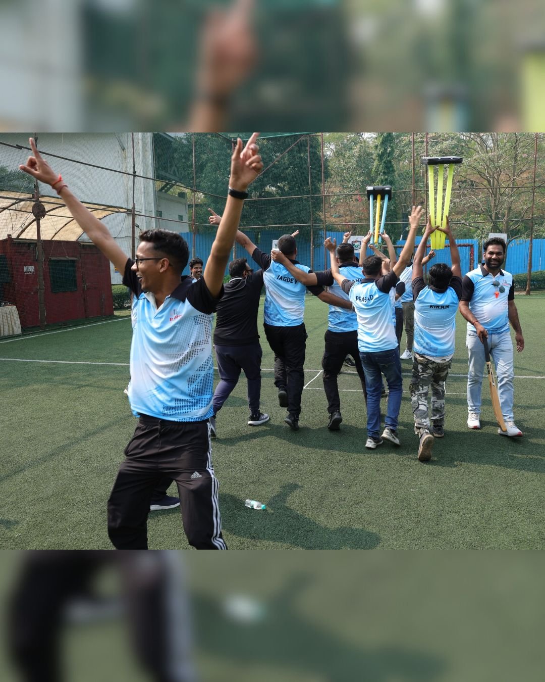 Team members celebrating on the sports field