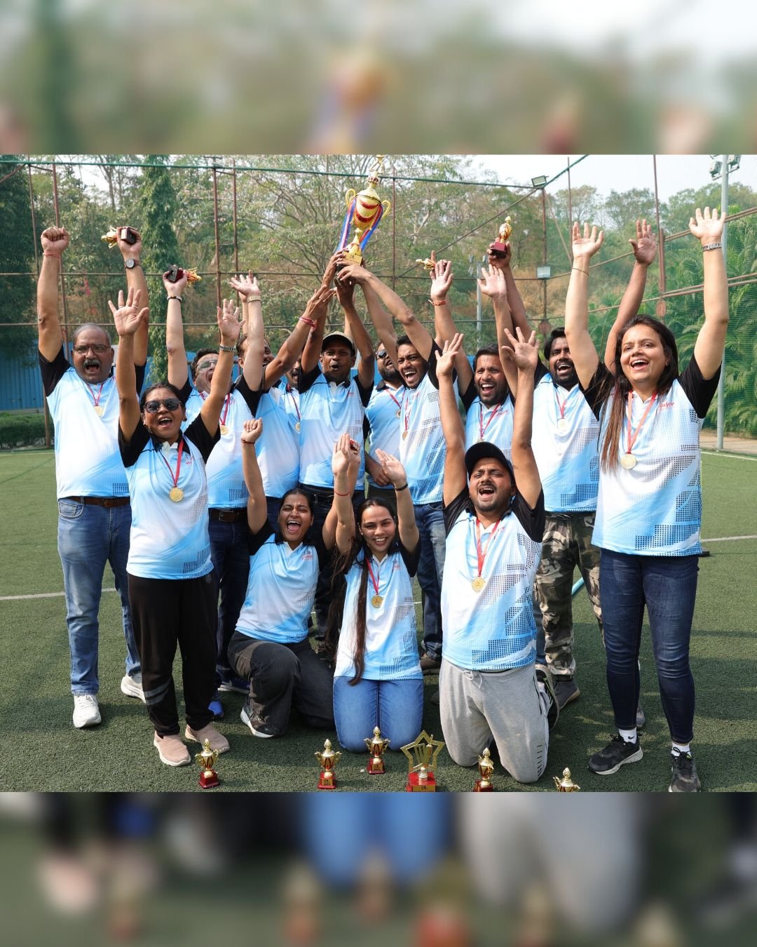 Colleagues raising their hands in celebration