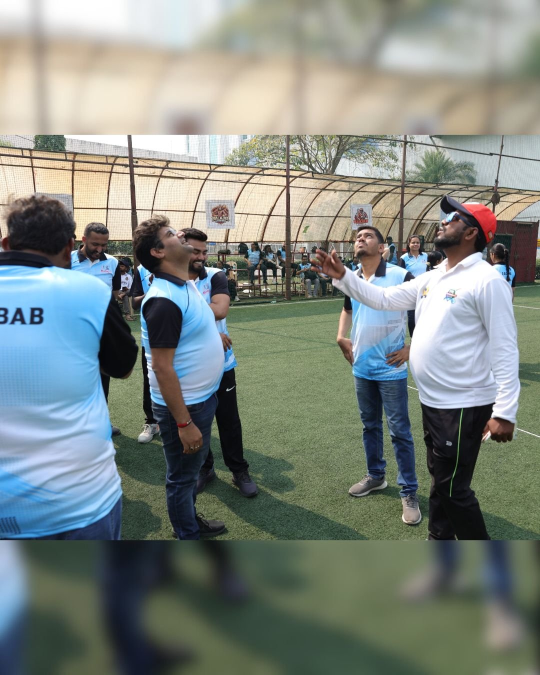 Colleagues sharing a moment on the sports field