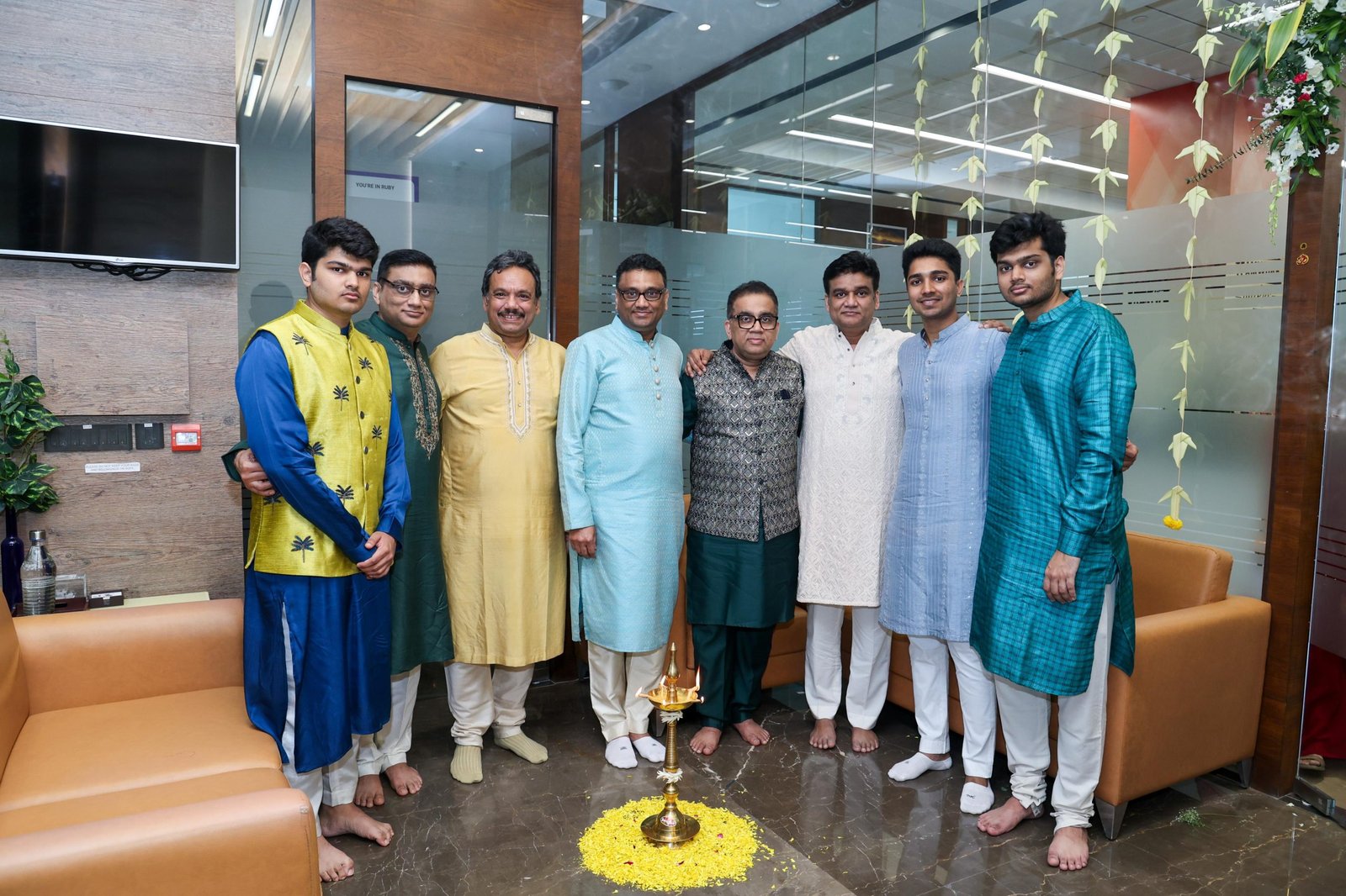 Colleagues gathered in traditional attire
